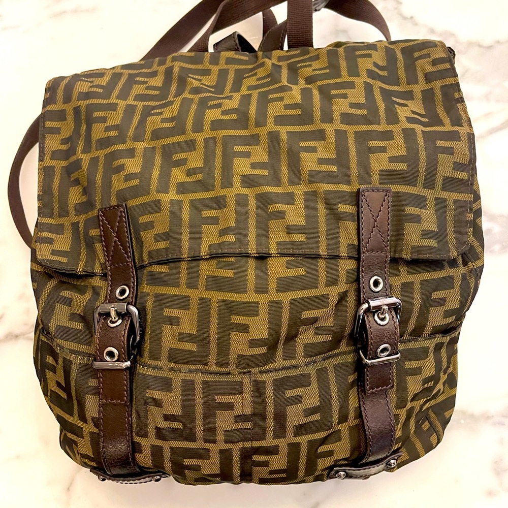 Fendi Backpack. Iconic canvas w/ leather detail. Serial number shown.